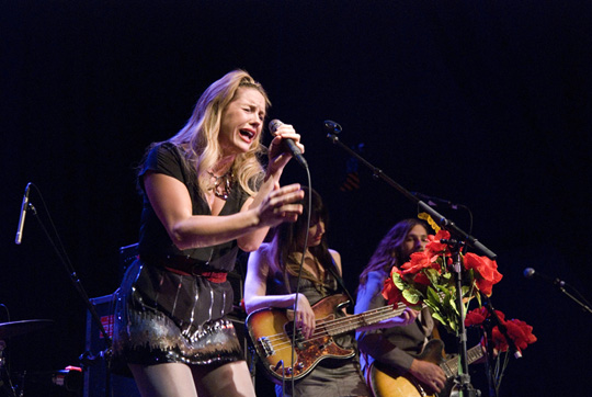 Grace Potter belts out a lead with bassist Catherine Popper and rhythm 